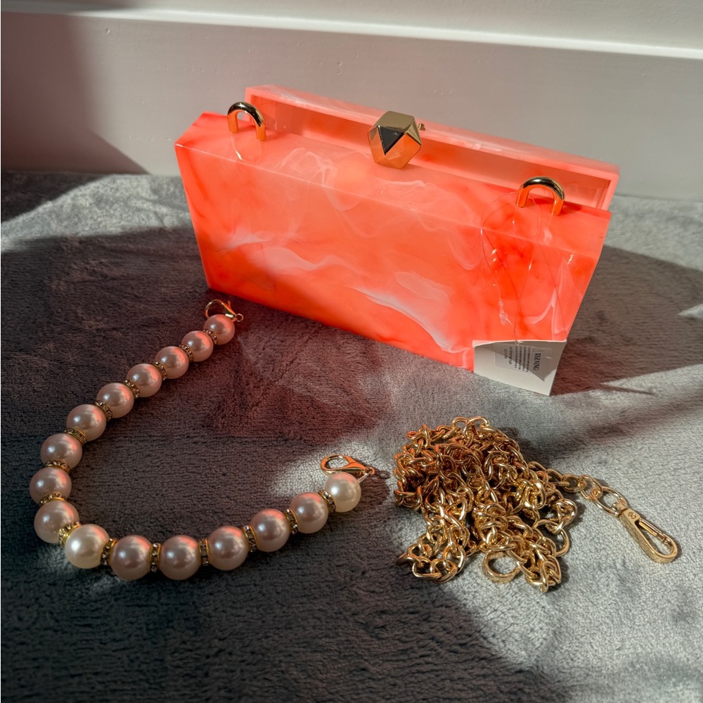 Acrylic Marbled Neon Orange Clutch with Gold crossbody chain and Pearl handle